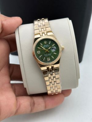 Rolex land dweller gold with green dial