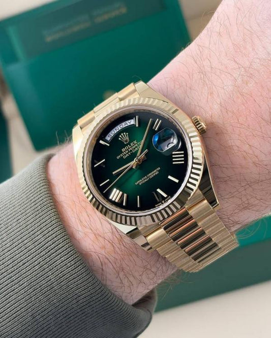 Rolex gold green dial