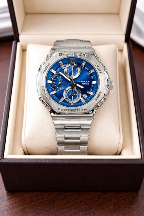 Casio G-Shock silver chain with blue dial